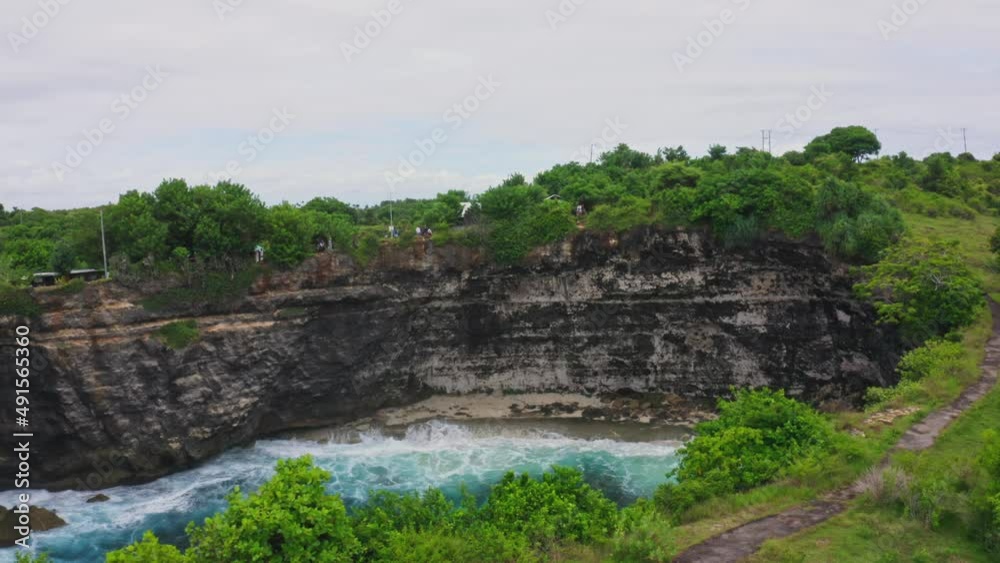 4K Aerial video of  blue waves in the ocean beach. 