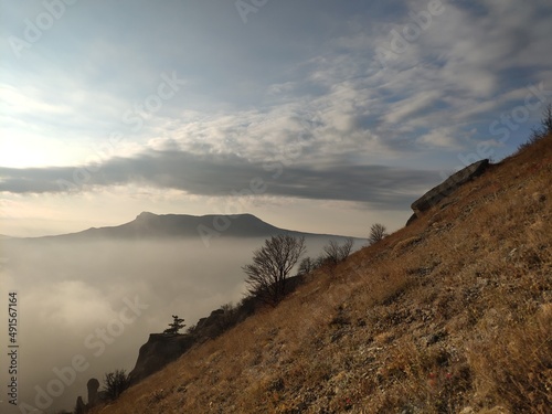 View on Crimean mountain Chatyr-Dag, near Alushta city, from Demerdzhi mountain. Scenic view on sunset with fog.