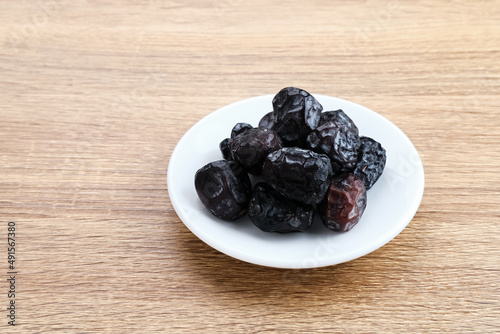 Kurma Ajwa, Ajwa Dates, served in small plate. Kurma Ajwa is one of the special fruit of Arabic.