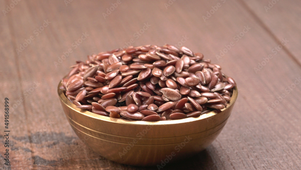 Brown flax seed or linseed on wooden background. Diet healthcare healthy food.
Brown flax seed or linseed on wooden background. Diet healthcare healthy food.