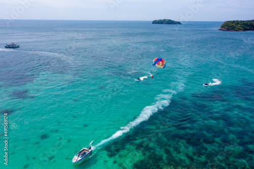Tourists are playing parasailing game on Phu Quoc island, Vietnam