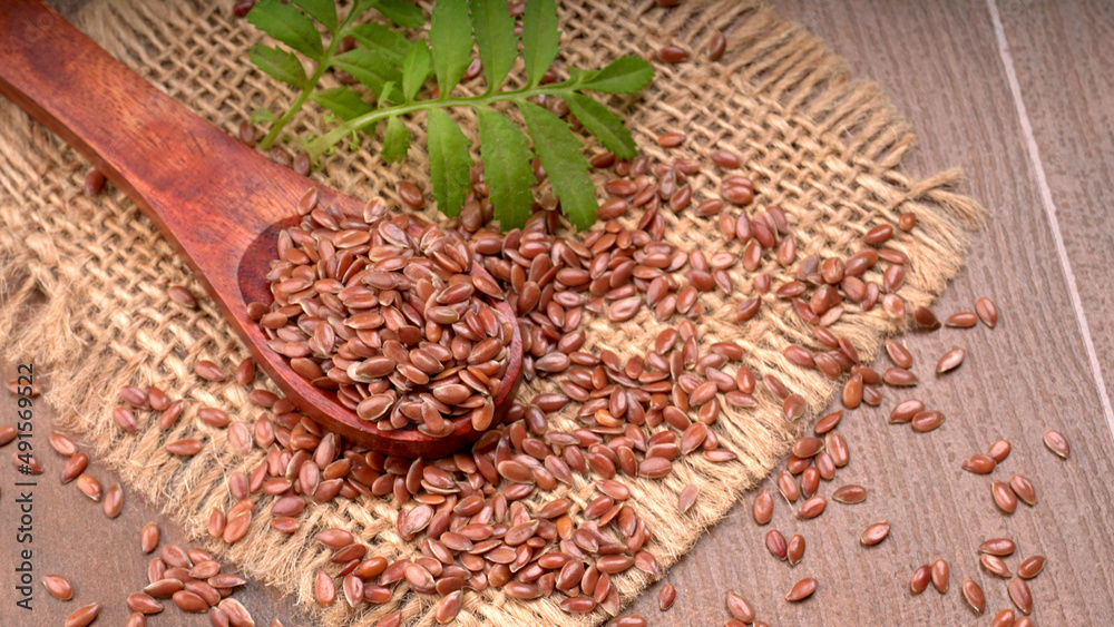 Brown flax seed or linseed on wooden background. Diet healthcare healthy food.
Brown flax seed or linseed on wooden background. Diet healthcare healthy food.