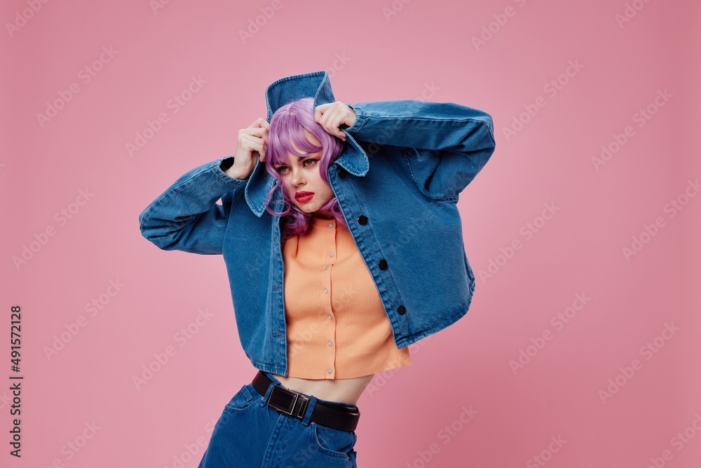 pretty woman purple hair fashion glasses denim clothing color background  unaltered Stock Photo