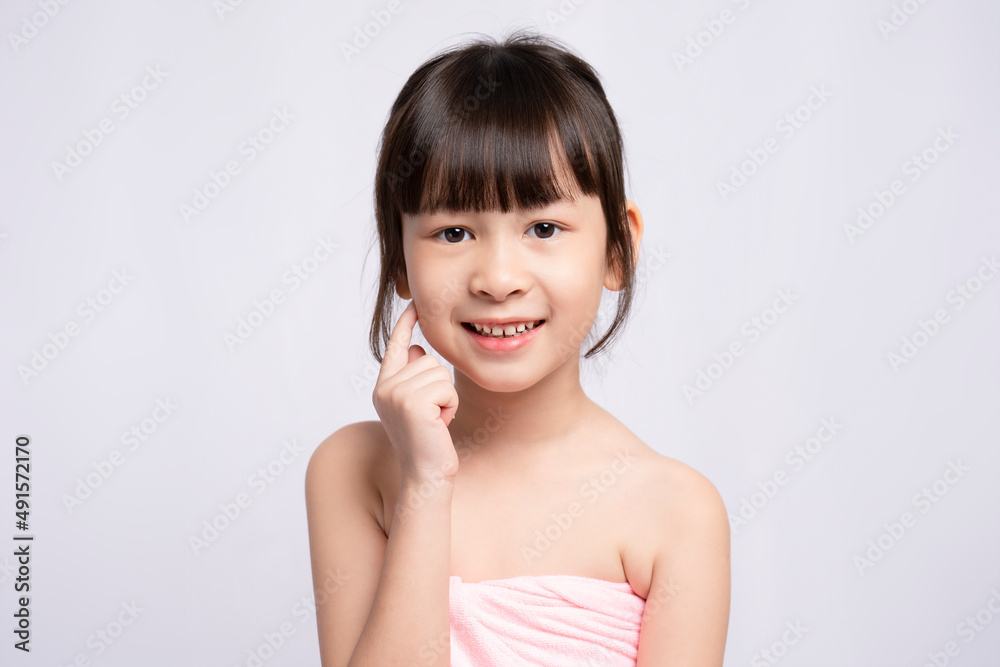 Asian girl, bright face on white background, Skin care beauty treatments concept. White model with clean, health skin of face. young girl's face Asian girl, bright face on white background, Skin care beauty treatments concept. White model with clean, health skin of face. young girl's face