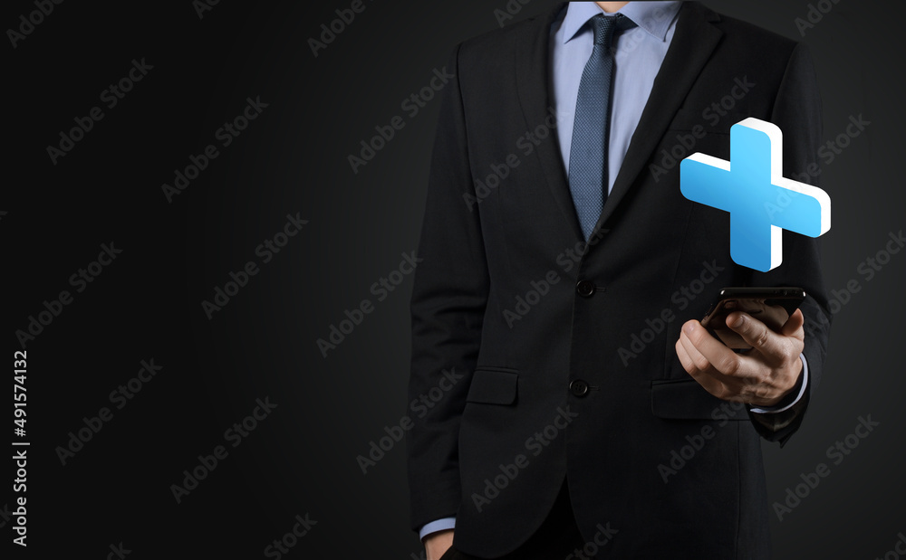Businessman hold 3D plus icon, man hold in hand offer positive thing such as profit, benefits, development, CSR represented by plus sign.The hand shows the plus sign Businessman hold 3D plus icon, man hold in hand offer positive thing such as profit, benefits, development, CSR represented by plus sign.The hand shows the plus sign