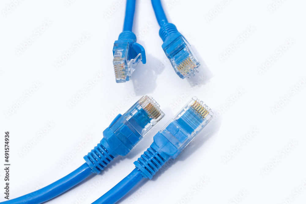 LAN network connection ethernet blue cables on white background. LAN network connection ethernet blue cables on white background.