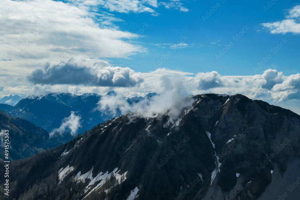 Panoramic view near Frauenkogel on the mountain peaks in the Karawanks, Carinthia, Austria. Borders Austria, Slovenia, Italy. Triglav National Park. Looking on mount Hochstuhl (Stol). Forest valley