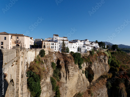Amazing village of Ronda. White villages in the province of Malaga, Andalusia, Spain. Beautiful village on the cliff of the mountain. Touristic destination. Holidays and enjoy the sun. 