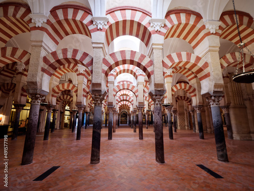 Interior of the Mosque Cathedral of Cordoba. UNESCO World Heritage site Spain. Columns and arches. Historic and touristic holidays and destinations.  © stu.dio