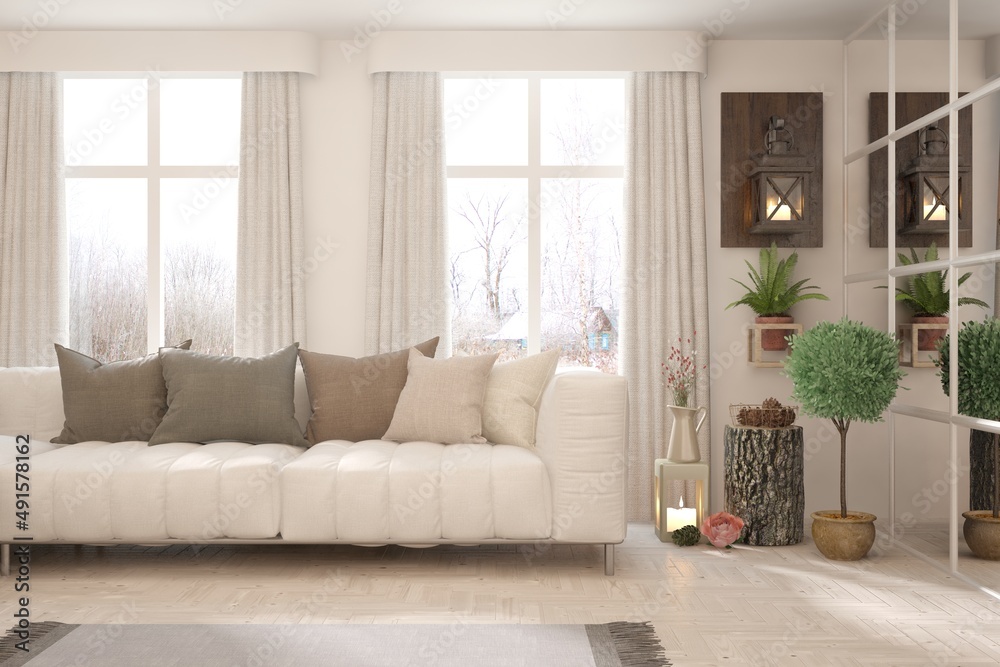 Fototapeta premium White living room with sofa and winter landscape in window. Scandinavian interior design. 3D illustration