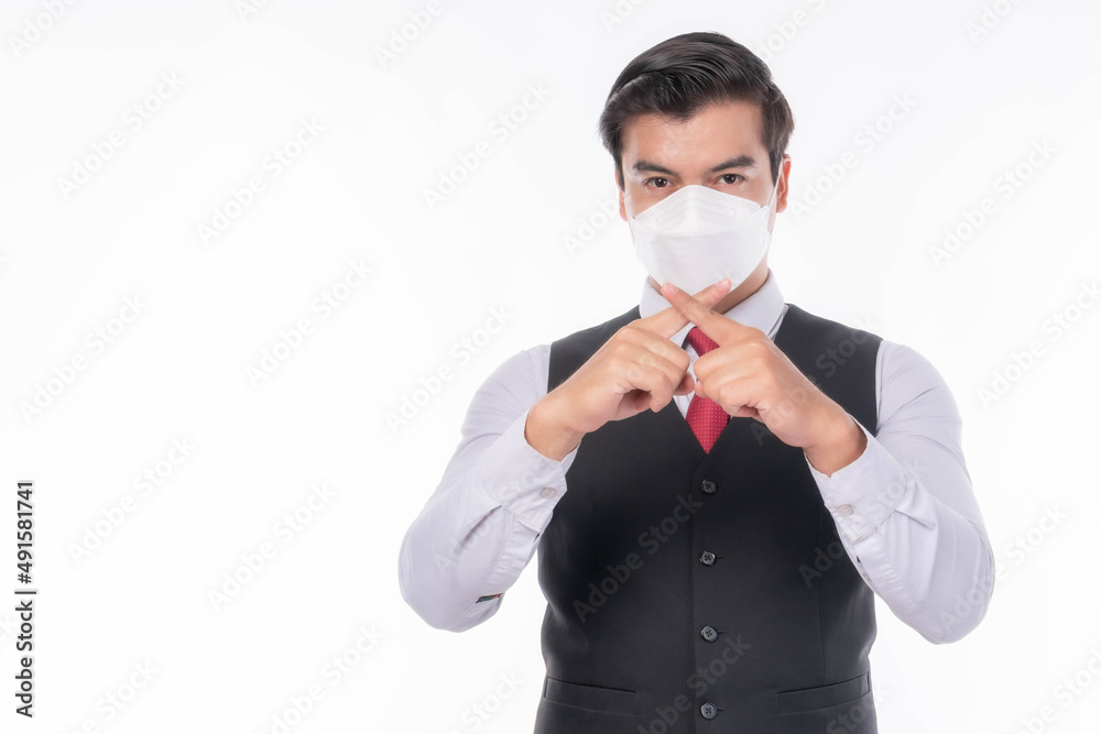 Stop Civid-19 , Asian man wearing Face Mask show stop hands gesture for stop corona virus outbreak , protect spread Covid-19 Coronavirus and protect pm 2.5 concept Stop Civid-19 , Asian man wearing Face Mask show stop hands gesture for stop corona virus outbreak , protect spread Covid-19 Coronavirus and protect pm 2.5 concept