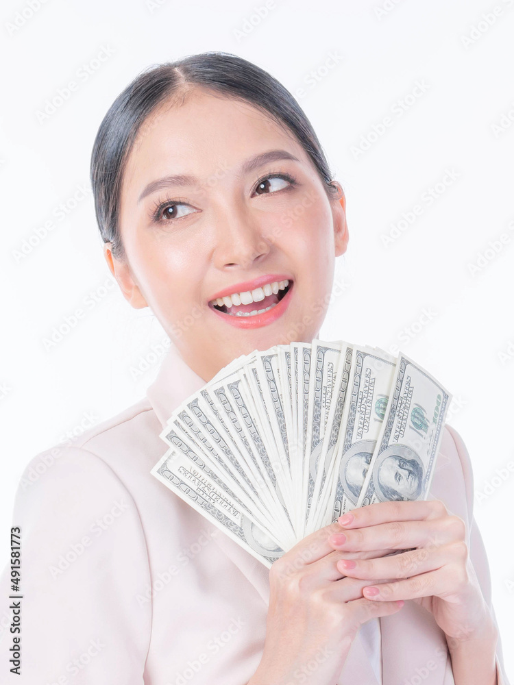 Successful beautiful Asian business young woman holding money US dollar bills in hand , business concept Successful beautiful Asian business young woman holding money US dollar bills in hand , business concept