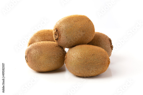 Ripe whole kiwi fruits isolated on a white background