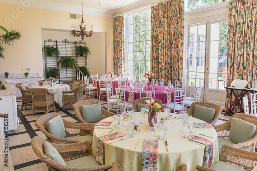 Round table with white table cloth and flowers