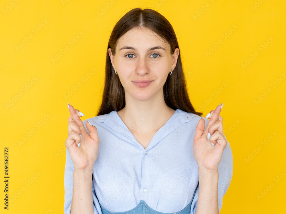 Good luck. Praying woman. Hopeful believes. Pretty inspired faithful lady crossing fingers asking wish come truth isolated yellow. Good luck. Praying woman. Hopeful believes. Pretty inspired faithful lady crossing fingers asking wish come truth isolated yellow.