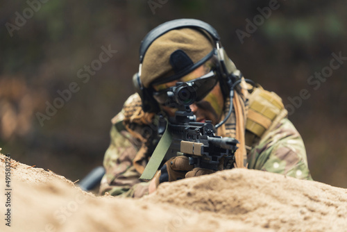 Covert soldier on a mission to assassinate leader . High quality photo photo