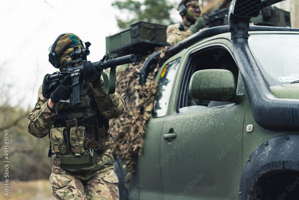 Female soldier confronting suspects on battlefield . High quality photo Female soldier confronting suspects on battlefield . High quality photo
