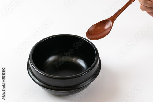 Clay pot and tableware on a white background