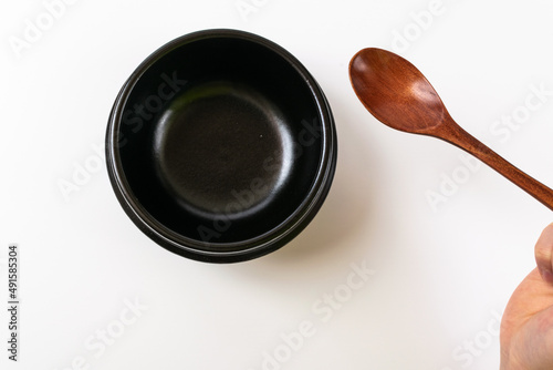 Clay pot and tableware on a white background