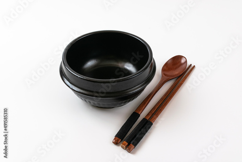Clay pot and tableware on a white background