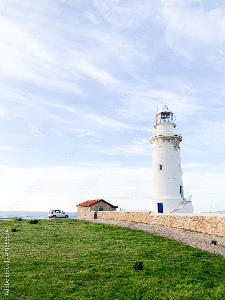 White lighthouse in the idyllic landscape White lighthouse in the idyllic landscape