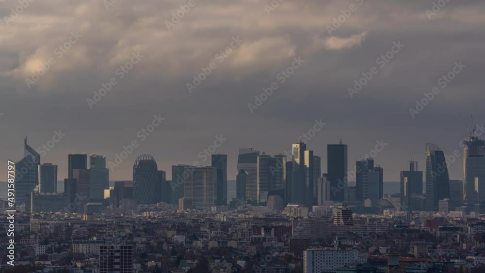 La Defense Business District Under Stormy Clouds With Sunlight on Towers Paris La Defense Business District Under Stormy Clouds With Sunlight on Towers Paris