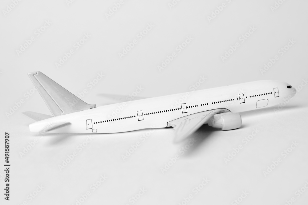 Airplane on white background with copy space, close-up