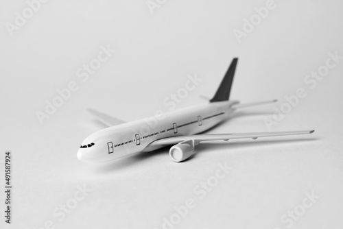 Airplane on white background with copy space, close-up