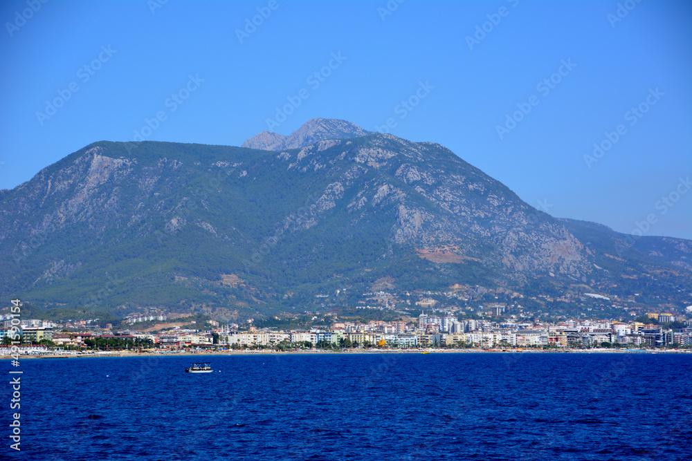 dark blue water of mediterranean sea with mountain background