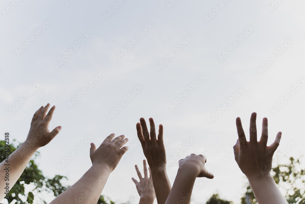 Hands of dancing people. Fun at a live concert. Summer party. Entertainment of a group of people Hands of dancing people. Fun at a live concert. Summer party. Entertainment of a group of people