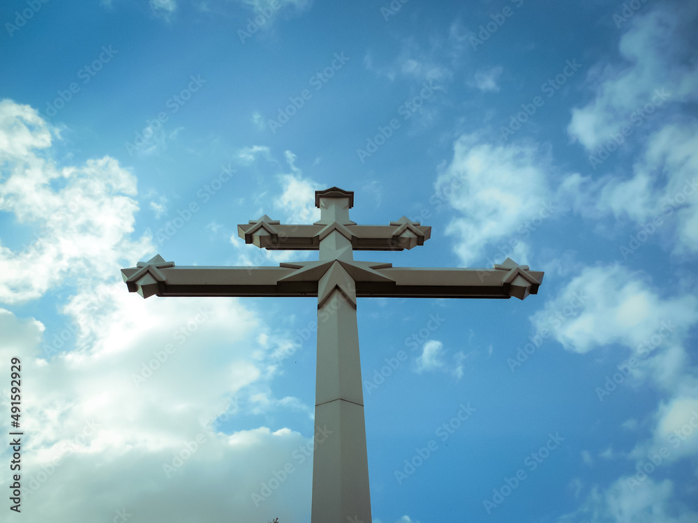 Orthodox cross against the blue sky. God and religion.
