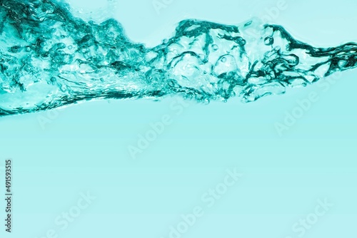 Soft focus cosmetic moisturizer water toner or emulsion emerald green blue herbal extract abstract background
