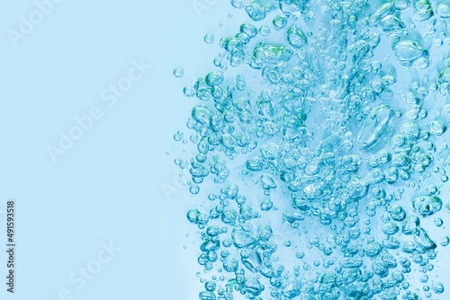 Soft focus cosmetic moisturizer water toner or emulsion blue oxygen moisture abstract background 