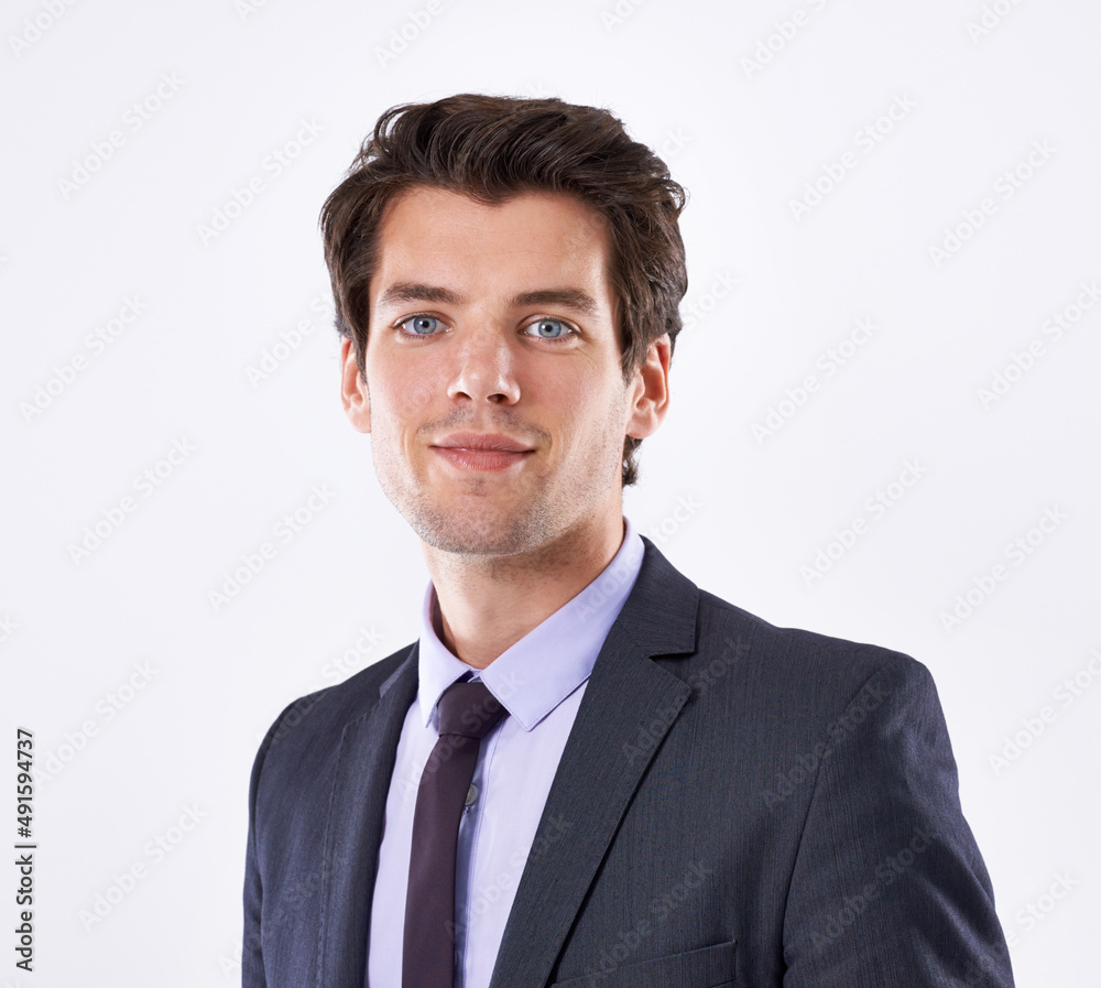Corporate confidence. Studio shot of a handsome young businessman against a white background. Corporate confidence. Studio shot of a handsome young businessman against a white background.