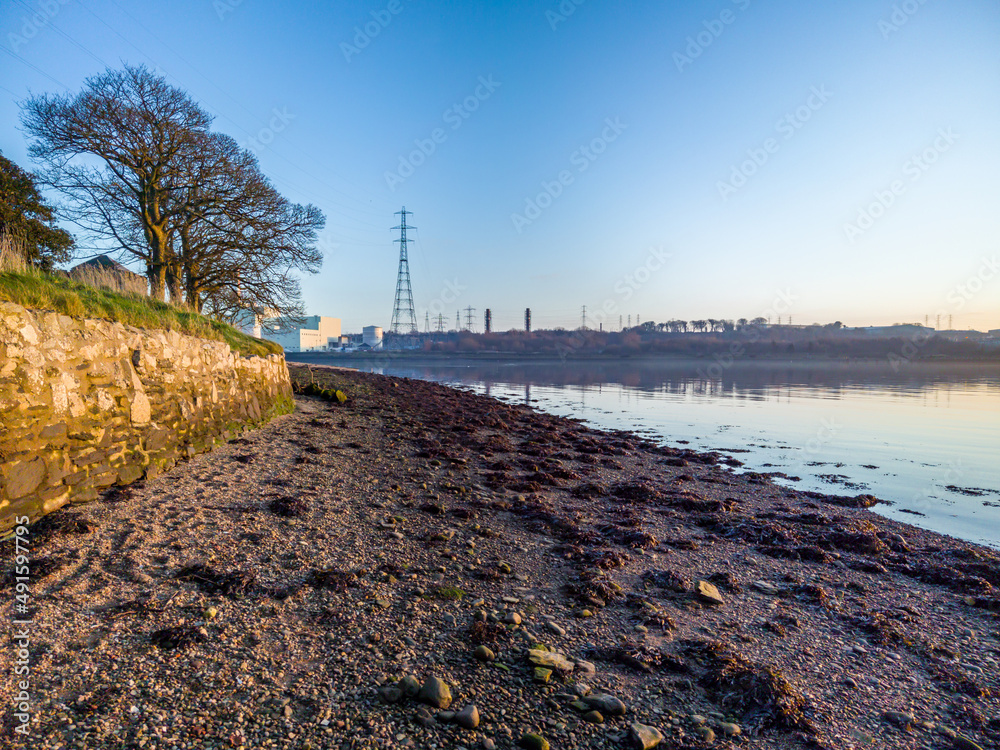 Beautiful evening on the river bank of the River Foyle at Culmore Point, Derry, Londonderry - Northern Ireland