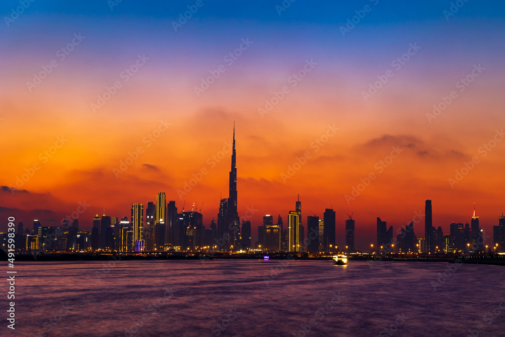 Dubai City Skyline in the evening with a colorful sky.
