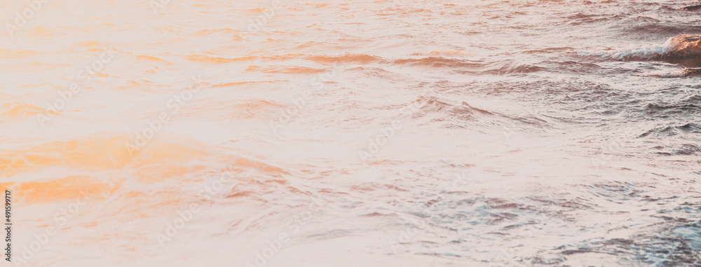 beautiful sea waves at sunset - beach holiday background beautiful sea waves at sunset - beach holiday background