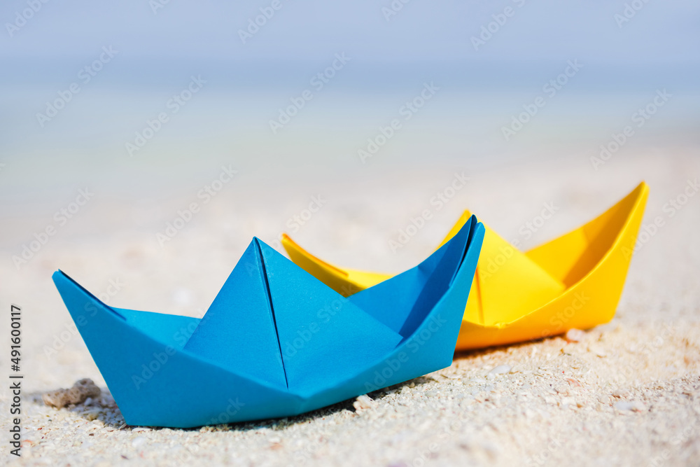 colorful paper boats at the tropical beach colorful paper boats at the tropical beach