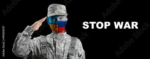 Saluting male soldier with ...