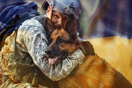 Soldier hugging military wo...