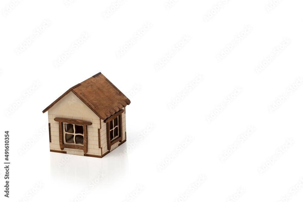 Small wooden house isolated on white background. Copy space. Small wooden house isolated on white background. Copy space.