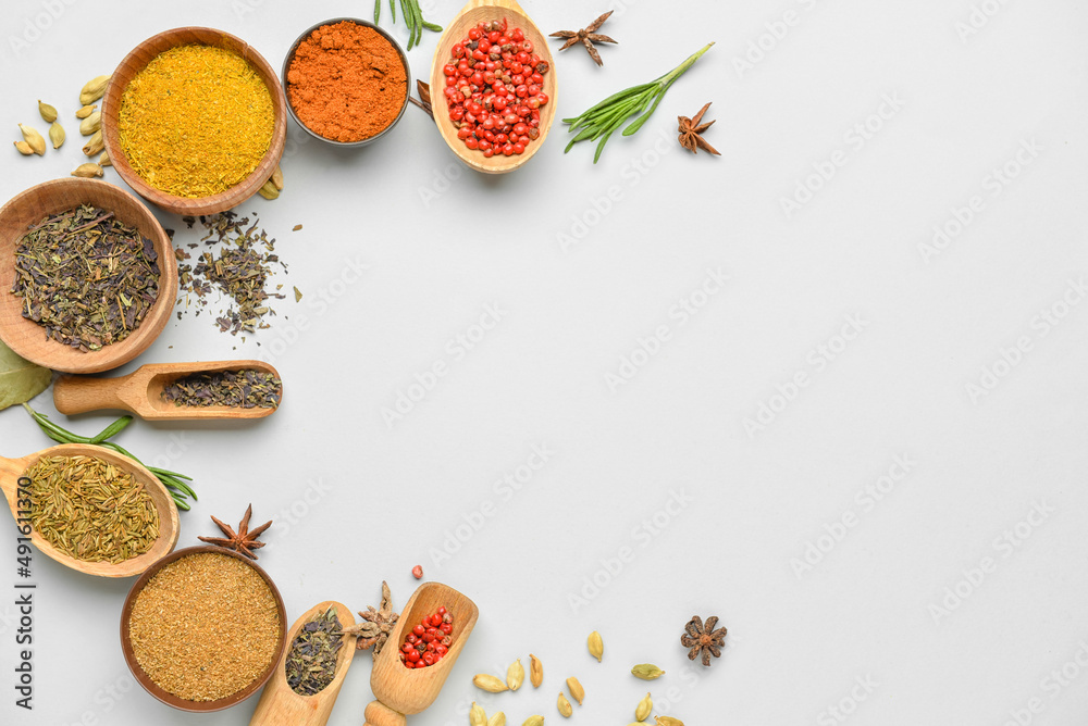 Composition with different spices and herbs on white background