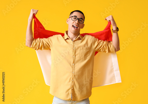 Happy young Asian man in ey...