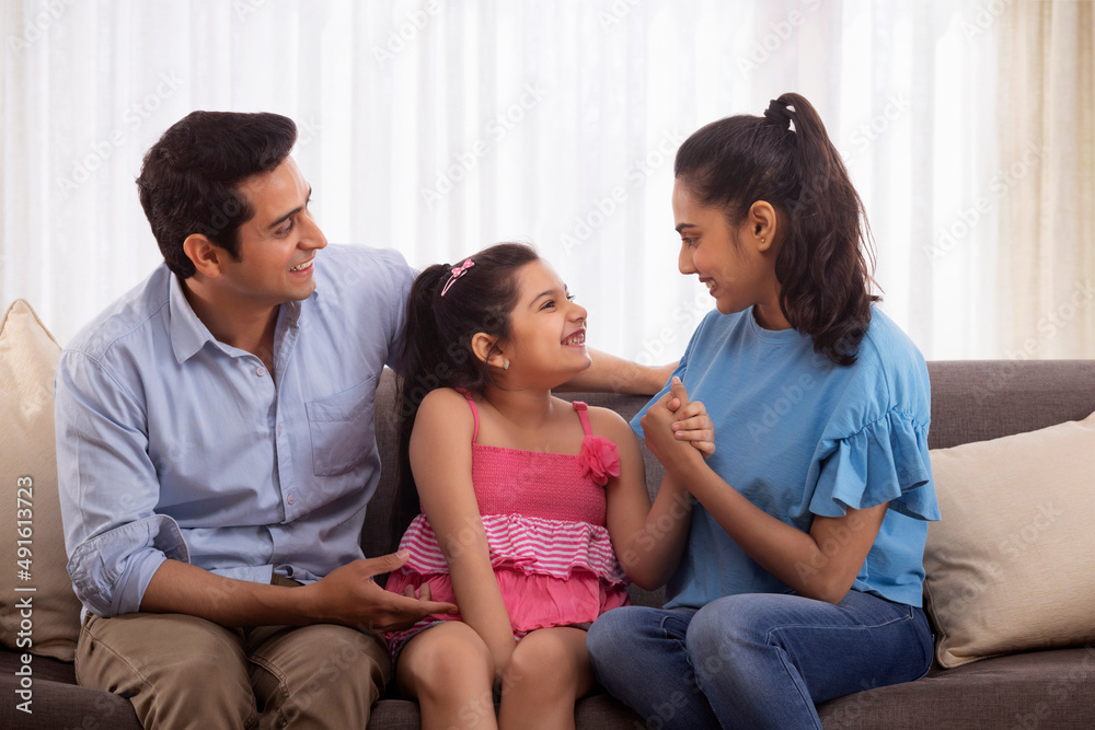 Parent spending time with their girl child at home during leisure period Parent spending time with their girl child at home during leisure period