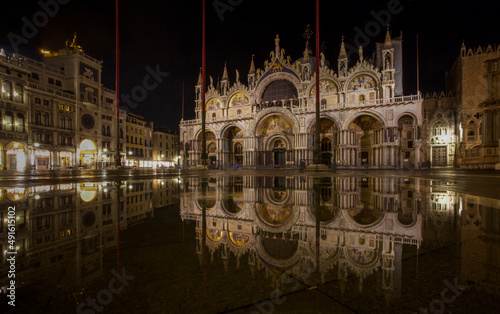St Mark's Basilica, Venice, reflected in water, at night