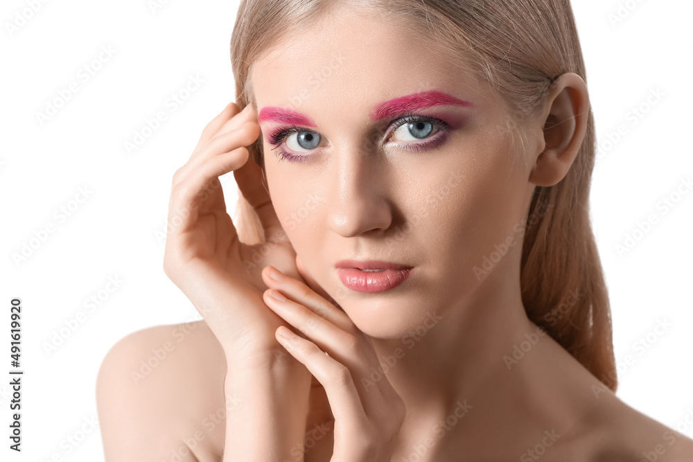 Young woman with creative makeup on white background