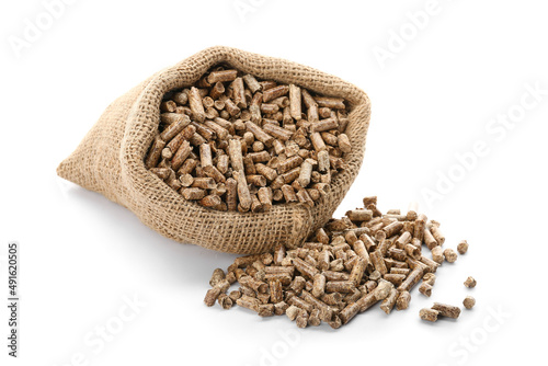 Sack with wood pellets on white background photo