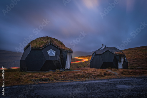 Canvas Print Kvivik Streymoy Faroe Islands, Denmark, Europe november 2021: Weird houses - two tiny geometric igloo homes with grass roofs on the hills