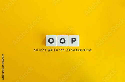 Object-oriented programming (OOP) Banner. Letter Tiles on Yellow Background. Minimal Aesthetics. photo