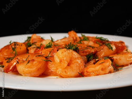 Fried king prawns on a white plate, close-up